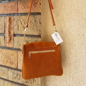 Genuine custom made leather purses and laptop bags